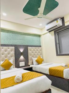 Postel nebo postele na pokoji v ubytování Hotel New Imperial