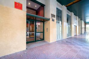 an empty hallway of a building with a sign on it at Apartamentos GO - Génova Parquesol - Parking Gratuito in Valladolid