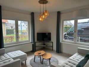 Televiisor ja/või meelelahutuskeskus majutusasutuses Duinzand