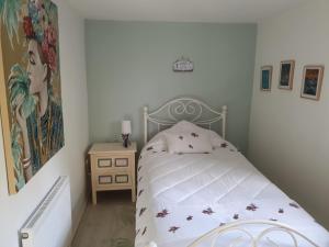 a bedroom with a bed with a white bedspread at Bayview Bed & Breakfast in Béal an dá Chab