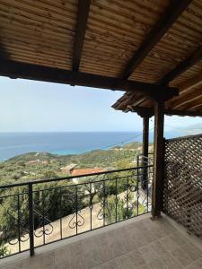 a view of the ocean from the balcony of a house at Evita's House in Lukovë