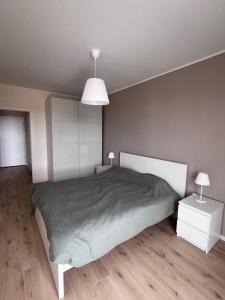 Postel nebo postele na pokoji v ubytování Słoneczny apartament w Gdańsku