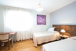 Llit o llits en una habitació de Apartamentos Go - Chalet Calera