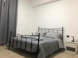 Ένα ή περισσότερα κρεβάτια σε δωμάτιο στο Ribera villa alloggio 2