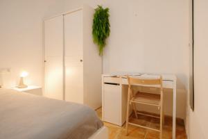 A bed or beds in a room at Apartamento Céntrico