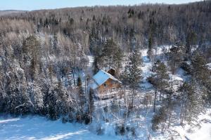 an aerial view of a house in the snow at Lake front in the woods Newly furnished in Saint-Didace