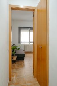 A bed or beds in a room at Apartamento Céntrico