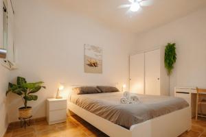 A bed or beds in a room at Apartamento Céntrico