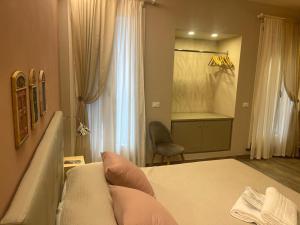 a bedroom with a bed and a dressing room at Hotel Il colle di Monterosso in Monterosso al Mare