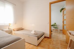 A bed or beds in a room at Apartamento Céntrico