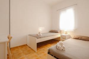 A bed or beds in a room at Apartamento Céntrico