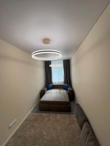 Ένα ή περισσότερα κρεβάτια σε δωμάτιο στο Здесь уютно