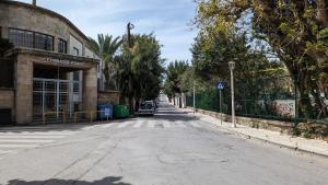 an empty street in a city with a building at GIANNIS HOUSE in Rhodes Town