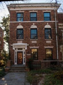 a red brick building with a front door at 2 Bedroom by Zoo, Metro, Park and Embassies in Forest Hills - Best Location in Washington, D.C.