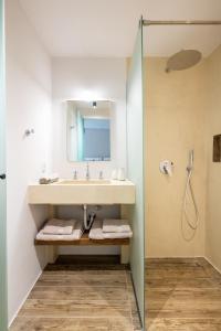 a bathroom with a sink and a shower at Kifissia Studio in Athens