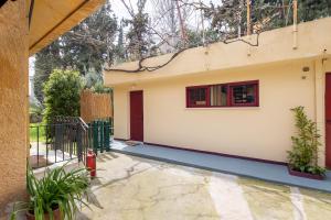 a house with a gate and a window at Kifissia Studio in Athens