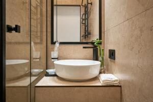 Koupelna v ubytování FIMKA Apart Hotel + 37 fotografií