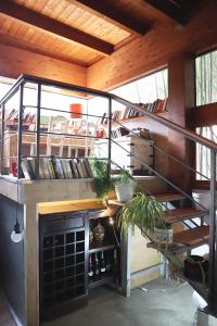 a staircase in a house with a room with a fireplace at Villa Alba Boutique Hotel in Pescara