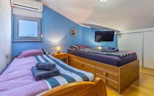 Ένα ή περισσότερα κρεβάτια σε δωμάτιο στο Ferienhaus Pošesi