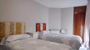 Postel nebo postele na pokoji v ubytování Apartamentos GO - Tordesillas House