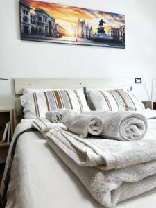 เตียงในห้องที่ Appartamento Città Giardino