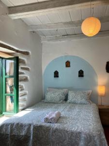 Säng eller sängar i ett rum på Cretan Holiday Cottage