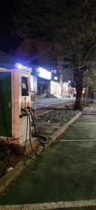a gas station with its electricity cords on the street at ApartHotel Catalin in Galaţi
