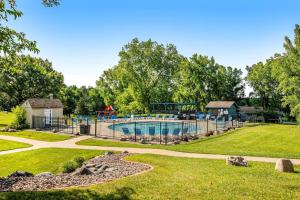 an image of a swimming pool in a park at Dells Getaway At Tamarack & Mirror Lake Resort in Wisconsin Dells