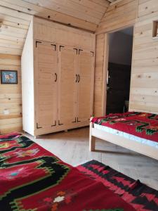 En eller flere senge i et værelse på Katun Siska Medna Dolina