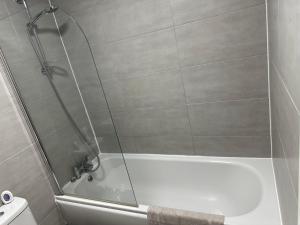 a shower with a glass door in a bathroom at The Landmark Brierley Hill in Dudley