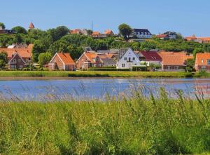 a town next to a river with houses at Haus Fabjerg in Lemvig