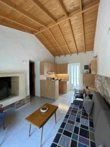 a living room with a couch and a table at Garden Ηouse 3 in Plomari
