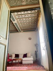 Postel nebo postele na pokoji v ubytování Palazzo Lauri Spoleto