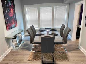 a dining room with a table and chairs at Cozy Luxury Apt~ near UChicago/HydePark/Lakeshore in Chicago