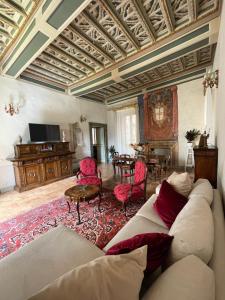 a living room with a couch and a table at Palazzo Lauri Spoleto in Spoleto