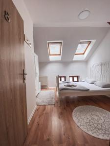 Postel nebo postele na pokoji v ubytování Blue Lotus Apartments