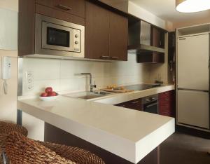 Η κουζίνα ή μικρή κουζίνα στο Luxury Suite Salou