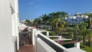 a balcony of a building with a view of a park at Naranjos Condado in Alhama de Murcia
