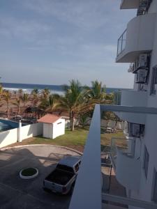 a view of the ocean from the balcony of a building at Ph olas tower in Palo Grande