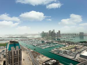 a view of a marina with boats in the water at 2-BDR, Dubai Marina, Canal and city view in Dubai