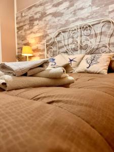a bedroom with a bed with a metal headboard at CASE VANELLA GRANDE aspra Bagheria in Bagheria +31 photos
