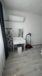 a room with a white desk and a mirror at Backyard Apart in Kemer +19 photos