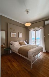 a bedroom with a large bed and a window at Caravin Wanderhome Acropolis, 1 min from Acropolis Museum in Athens