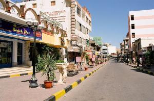 an empty street in a city with buildings at Four Seasons Hotel in Hurghada