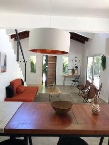 a living room with a table with a bowl on it at Casa Anna, Private Home, Guiones in Nosara