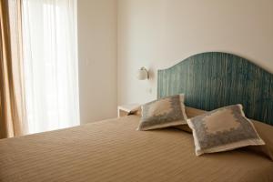 Postel nebo postele na pokoji v ubytování B&B Alalama