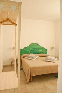 Postel nebo postele na pokoji v ubytování B&B Alalama