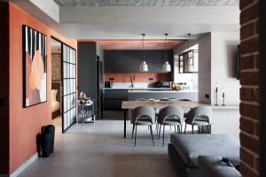 a kitchen and dining room with a table and chairs at Orama Luxury Suite 3 Bedrooms with Private Pool in Hersonissos