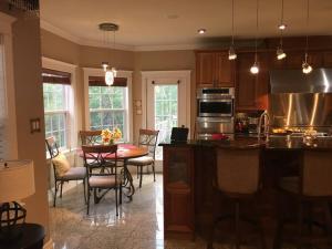 a kitchen and dining room with a table and chairs at Beautiful and Peaceful Home in Halifax