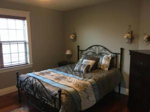 a bedroom with a bed with pillows on it at Beautiful and Peaceful Home in Halifax